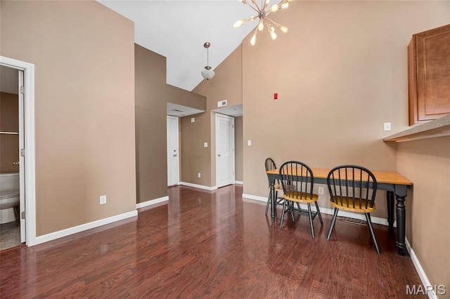 1131 Saravalle Dr, Saint Peters, MO 63376 - dining room featuring high vaulted ceiling, a chandelier, wood finished floors, and baseboards
