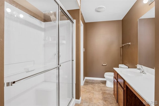 1131 Saravalle Dr, Saint Peters, MO 63376 - bathroom featuring a stall shower, vanity, toilet, and baseboards