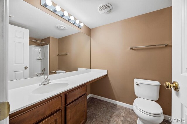 1131 Saravalle Dr, Saint Peters, MO 63376 - full bath featuring toilet, vanity, baseboards, a shower, and tile patterned floors