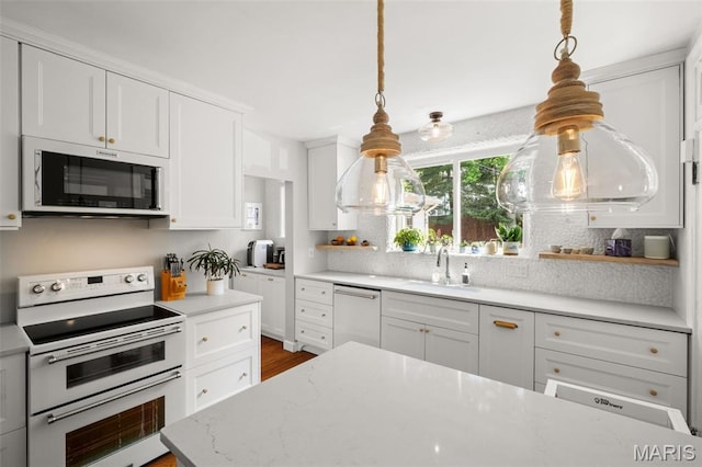 7424 University Dr, University City, MO 63130 - kitchen featuring range with two ovens, dishwasher, backsplash, and white cabinetry