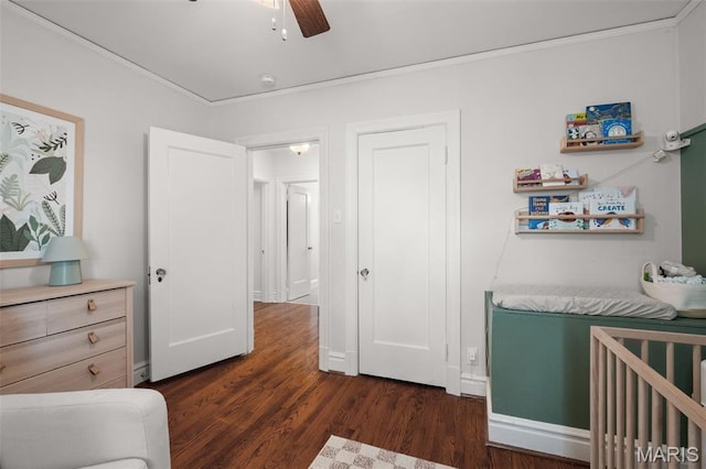 7424 University Dr, University City, MO 63130 - bedroom with dark wood finished floors, crown molding, and a ceiling fan