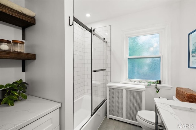 7424 University Dr, University City, MO 63130 - full bathroom with radiator, toilet, combined bath / shower with glass door, vanity, and recessed lighting