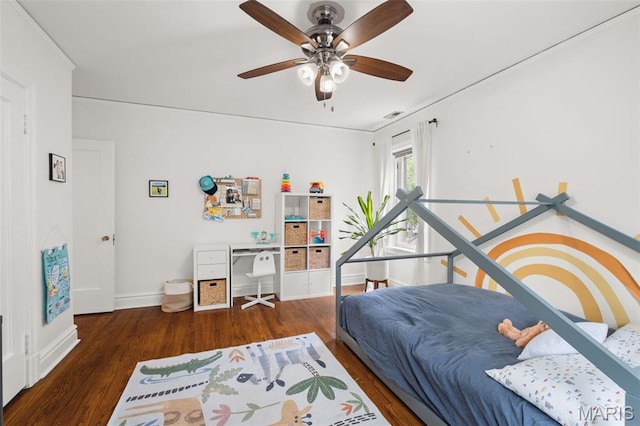 7424 University Dr, University City, MO 63130 - bedroom featuring baseboards, wood finished floors, and a ceiling fan