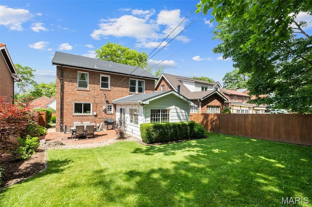 7424 University Dr, University City, MO 63130 - rear view of property with brick siding and a patio