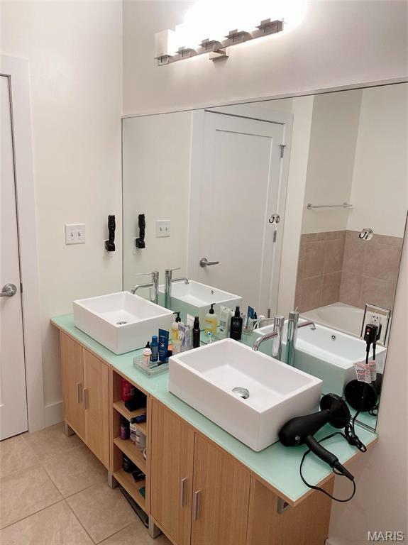 9 N Euclid Ave Unit 510, Saint Louis, MO 63108 - full bath featuring tile patterned floors, double vanity, and a bath