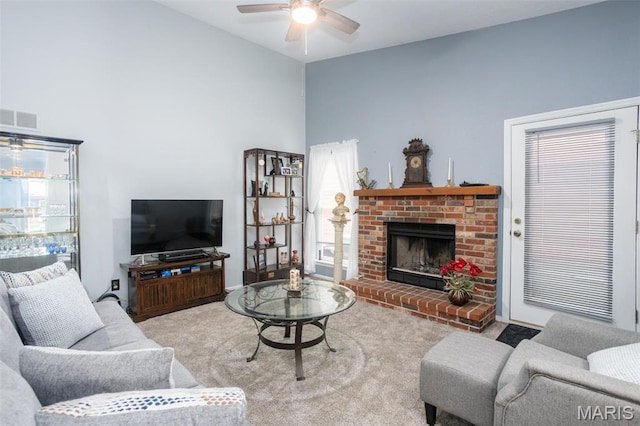 2114 Bayonne Dr Unit 29B, Saint Charles, MO 63303 - carpeted living area with ceiling fan, a brick fireplace, and high vaulted ceiling
