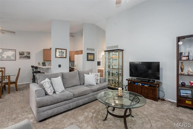 2114 Bayonne Dr Unit 29B, Saint Charles, MO 63303 - carpeted living area featuring ceiling fan, high vaulted ceiling, and baseboards