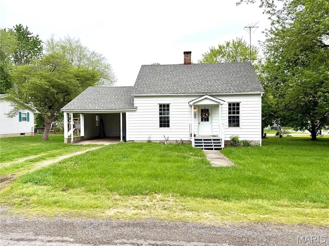 405 W Magnolia St, Marine, IL 62061 - new england style home with a chimney, a front lawn, a shingled roof, and a carport
