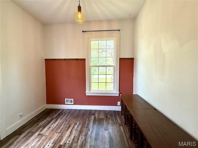 405 W Magnolia St, Marine, IL 62061 - unfurnished dining area featuring healthy amount of natural light, dark wood-type flooring, and baseboards