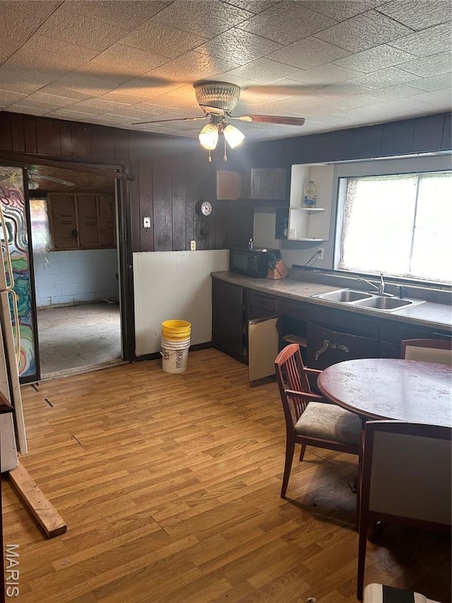 2481 Wayne 361, Piedmont, MO 63957 - kitchen with light wood-style flooring, black microwave, and ceiling fan