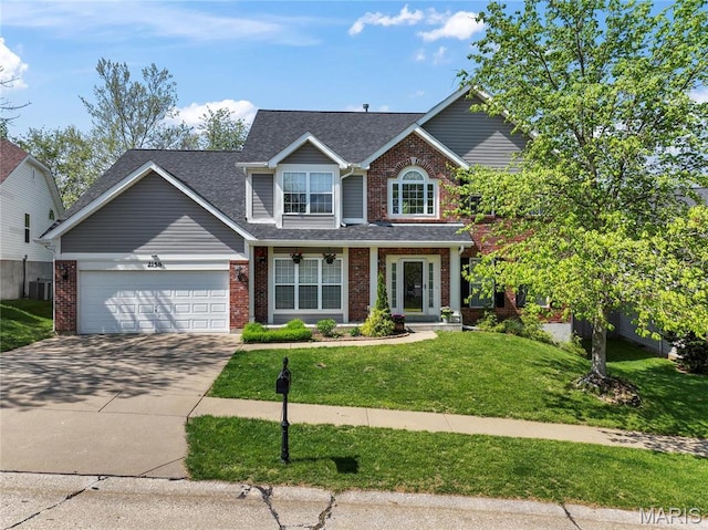 2158 Avalon Ridge Cir, Fenton, MO 63026 - traditional-style house featuring brick siding, an attached garage, driveway, a front lawn, and central AC