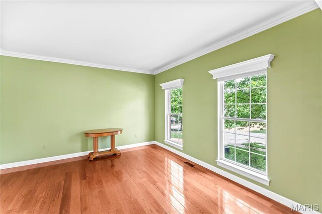 2158 Avalon Ridge Cir, Fenton, MO 63026 - spare room with crown molding, wood finished floors, and baseboards