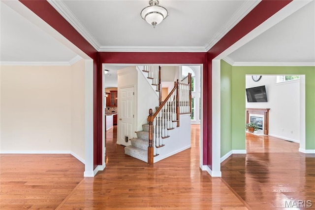 2158 Avalon Ridge Cir, Fenton, MO 63026 - entrance foyer featuring stairway, wood finished floors, crown molding, baseboards, and a fireplace