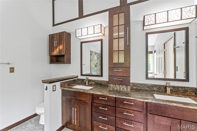 2158 Avalon Ridge Cir, Fenton, MO 63026 - full bath with double vanity, toilet, baseboards, and tile patterned flooring