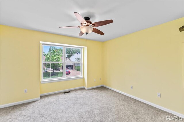 2158 Avalon Ridge Cir, Fenton, MO 63026 - spare room featuring carpet floors, a ceiling fan, and baseboards