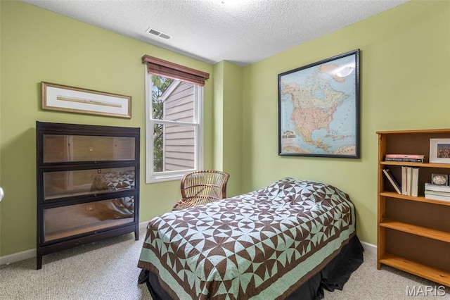 3677 Arpent St Unit 3, Saint Charles, MO 63301 - bedroom with carpet floors, a textured ceiling, and baseboards