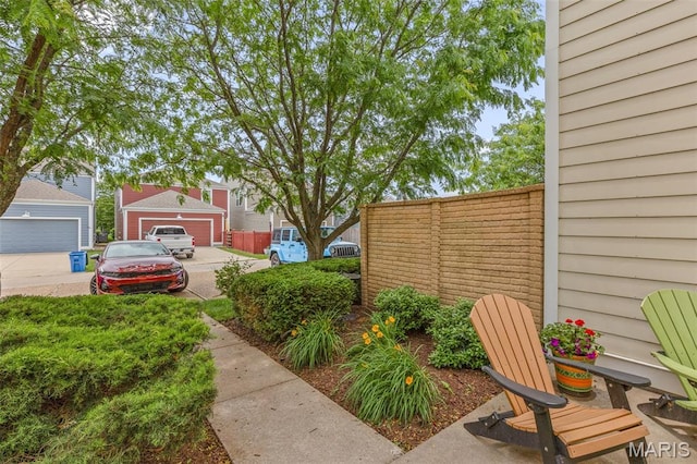 3677 Arpent St Unit 3, Saint Charles, MO 63301 - view of yard featuring a garage