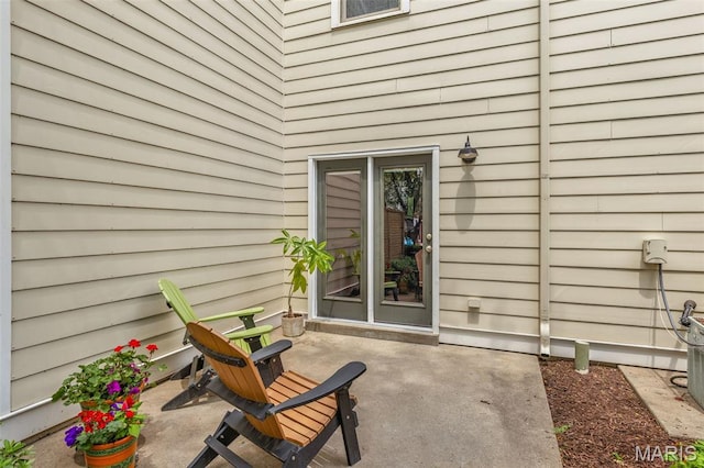 3677 Arpent St Unit 3, Saint Charles, MO 63301 - view of exterior entry with a patio area