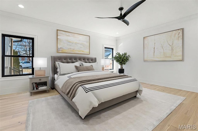 bedroom with baseboards, recessed lighting, ornamental molding, light wood-style floors, and a ceiling fan