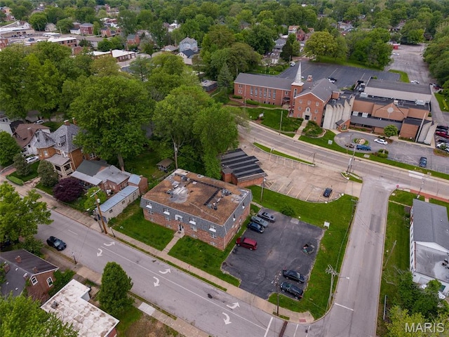 aerial view of property and surrounding area with nearby suburban area