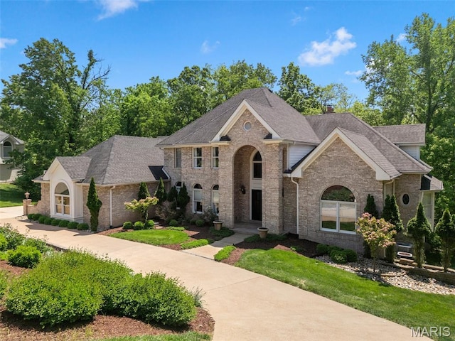 1424 Haarman Oak Dr, Wildwood, MO 63005 - view of front of house with brick siding and a shingled roof