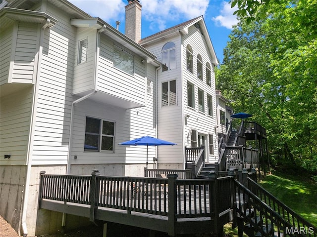 1424 Haarman Oak Dr, Wildwood, MO 63005 - rear view of property with stairs, a wooden deck, and a chimney