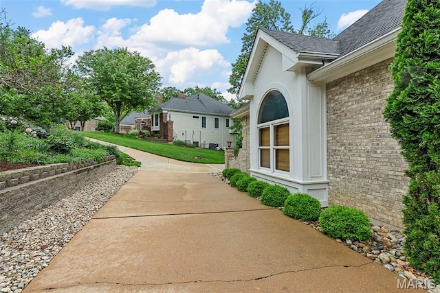 1424 Haarman Oak Dr, Wildwood, MO 63005 - view of side of home with brick siding and roof with shingles