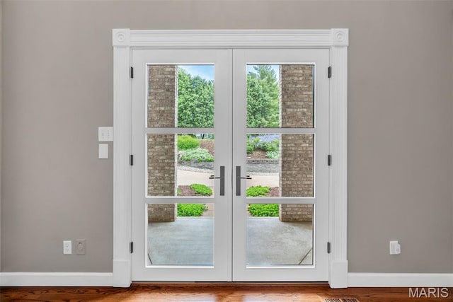 1424 Haarman Oak Dr, Wildwood, MO 63005 - doorway to outside with french doors, baseboards, and wood finished floors