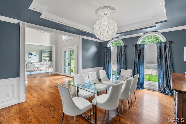1424 Haarman Oak Dr, Wildwood, MO 63005 - dining area featuring ornamental molding, plenty of natural light, a chandelier, a wainscoted wall, and a raised ceiling