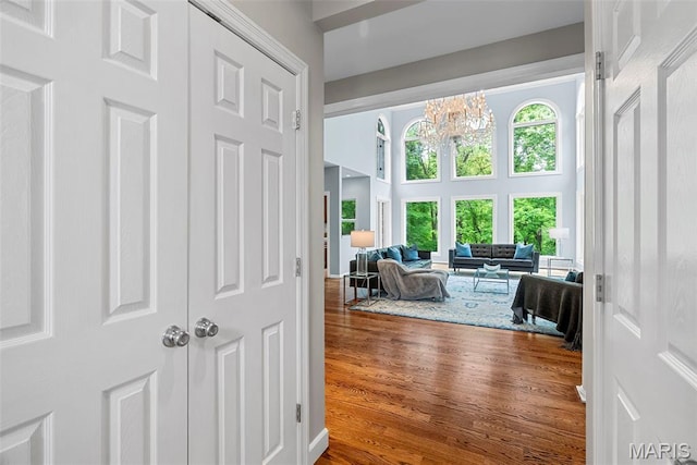 1424 Haarman Oak Dr, Wildwood, MO 63005 - corridor featuring a chandelier, wood finished floors, and a high ceiling