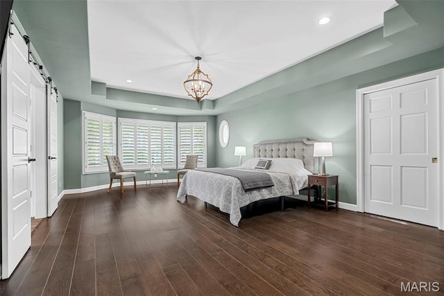 1424 Haarman Oak Dr, Wildwood, MO 63005 - bedroom with a barn door, baseboards, a chandelier, a raised ceiling, and recessed lighting