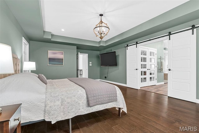 1424 Haarman Oak Dr, Wildwood, MO 63005 - bedroom with a barn door, baseboards, wood finished floors, and recessed lighting