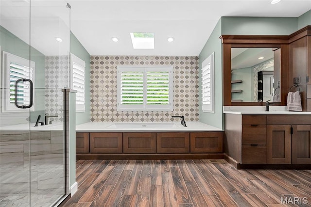 1424 Haarman Oak Dr, Wildwood, MO 63005 - bathroom with wood finished floors, a skylight, a bath, a shower stall, and recessed lighting