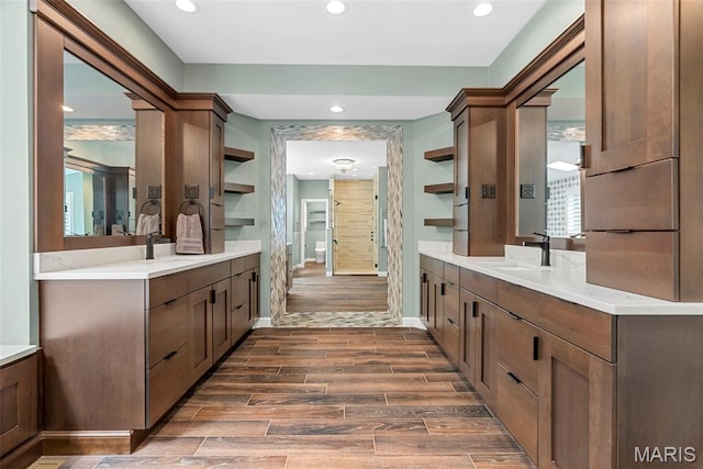 1424 Haarman Oak Dr, Wildwood, MO 63005 - bathroom with wood finish floors, recessed lighting, baseboards, two vanities, and a shower