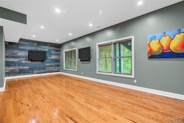 1424 Haarman Oak Dr, Wildwood, MO 63005 - unfurnished living room with an accent wall, baseboards, recessed lighting, and wood finished floors