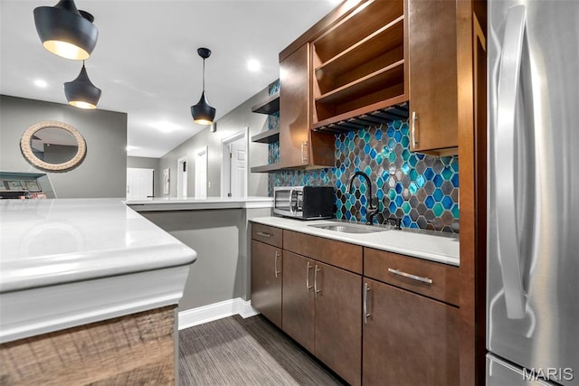 1424 Haarman Oak Dr, Wildwood, MO 63005 - kitchen with appliances with stainless steel finishes, open shelves, light countertops, tasteful backsplash, and a sink