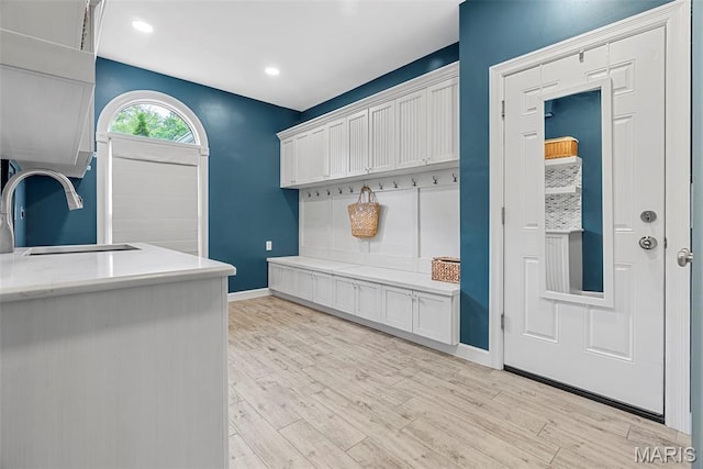 1424 Haarman Oak Dr, Wildwood, MO 63005 - mudroom with a sink, light wood finished floors, baseboards, and recessed lighting