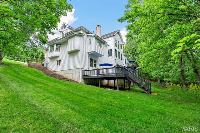 1424 Haarman Oak Dr, Wildwood, MO 63005 - back of house featuring a chimney, a wooden deck, a yard, and stairs