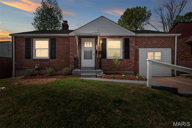 4717 Roxie St, Saint Louis, MO 63121 - view of front of property featuring brick siding, a chimney, and a front lawn