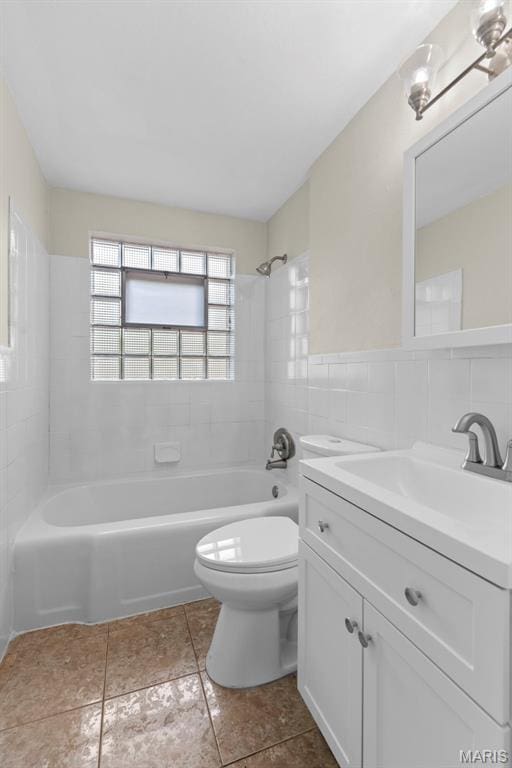 4717 Roxie St, Saint Louis, MO 63121 - bathroom with toilet, bathing tub / shower combination, vanity, tile patterned flooring, and tile walls