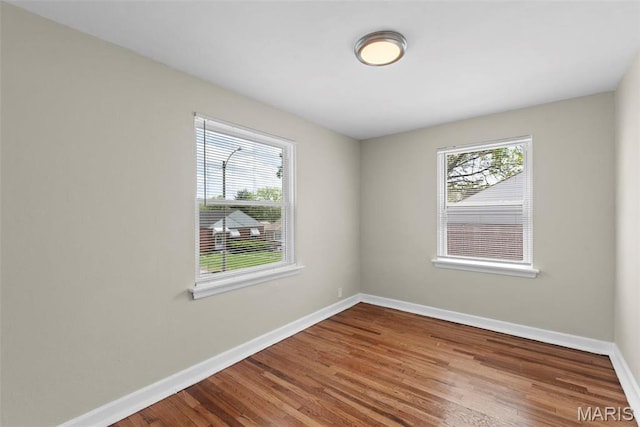 4717 Roxie St, Saint Louis, MO 63121 - unfurnished room featuring baseboards and wood finished floors