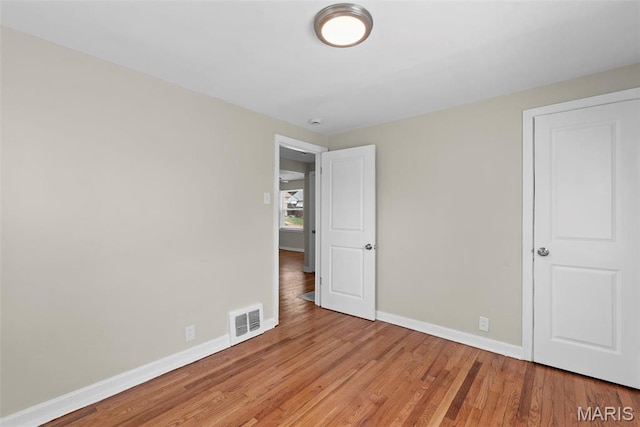 4717 Roxie St, Saint Louis, MO 63121 - unfurnished bedroom featuring baseboards and light wood finished floors
