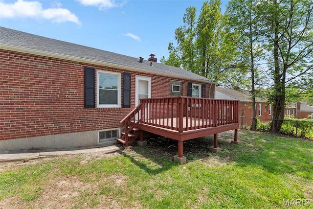 4717 Roxie St, Saint Louis, MO 63121 - back of house featuring a deck, brick siding, and a chimney