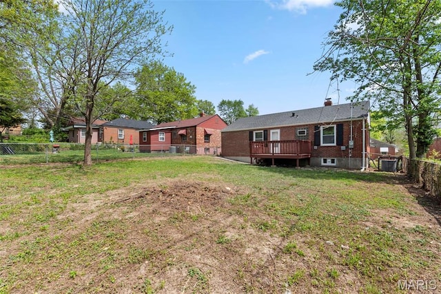 4717 Roxie St, Saint Louis, MO 63121 - rear view of house featuring brick siding, a wooden deck, cooling unit, and a chimney