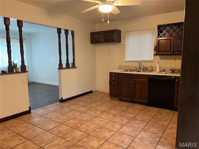 6145 Payne Ave, Saint Louis, MO 63135 - kitchen with black dishwasher, a sink, ceiling fan, light countertops, and dark brown cabinets