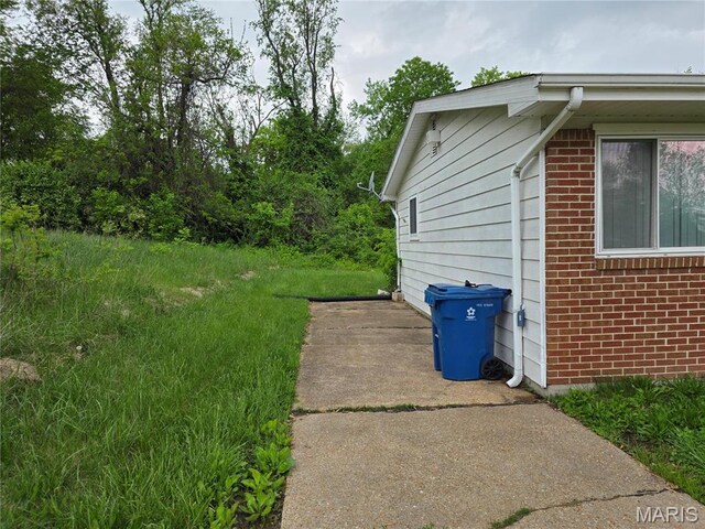 6145 Payne Ave, Saint Louis, MO 63135 - view of side of home with brick siding