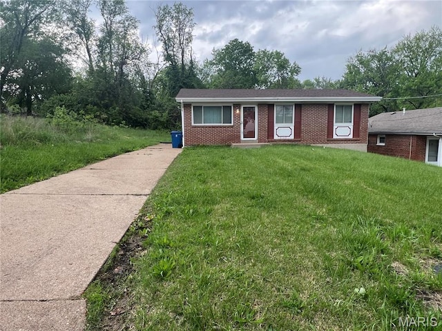 6145 Payne Ave, Saint Louis, MO 63135 - single story home with brick siding and a front yard