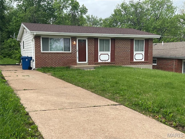 6145 Payne Ave, Saint Louis, MO 63135 - ranch-style house featuring brick siding, a front yard, and roof with shingles