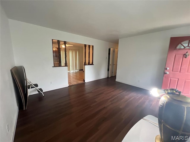 6145 Payne Ave, Saint Louis, MO 63135 - living area featuring wood finished floors, baseboards, and a ceiling fan