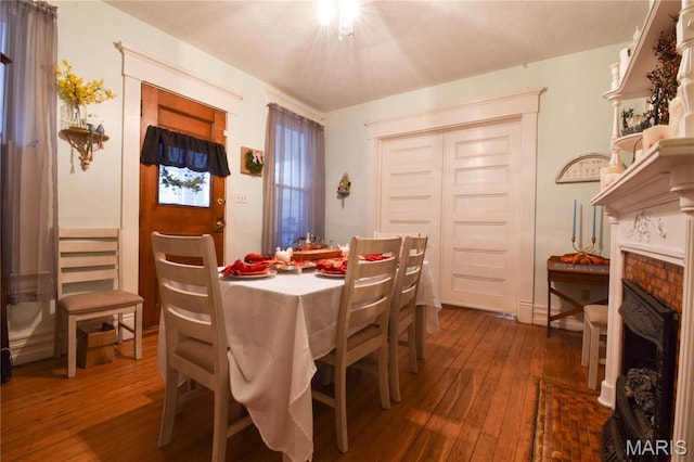 120 E Corbin St, Bethalto, IL 62010 - dining space featuring dark wood finished floors and a fireplace